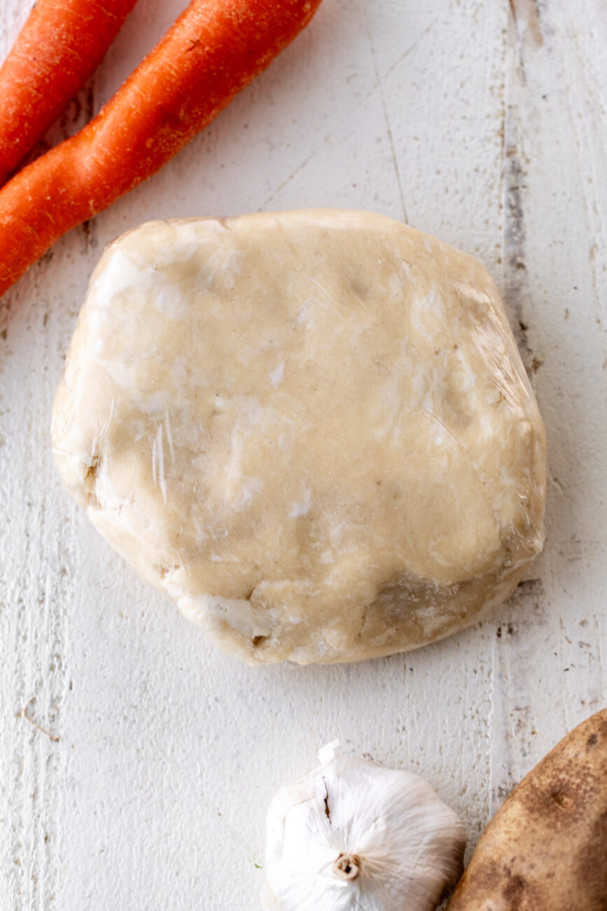 shortcrust pastry dough chilling in plastic wrap.