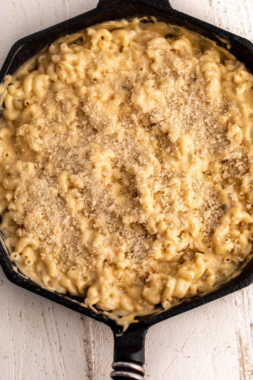 green chili mac and cheese topped with panko breadcrumbs.