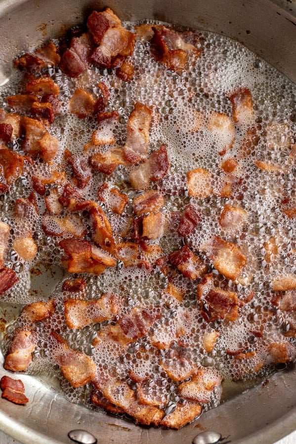 sautéed bacon in pan.