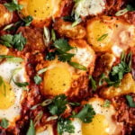 shakshuka recipe with fried halloumi spicy baked eggs in tomato sauce.