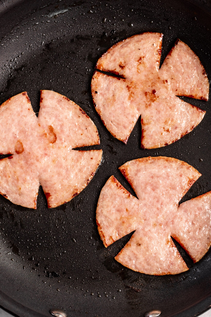 pan-fried taylor ham with scored edges.