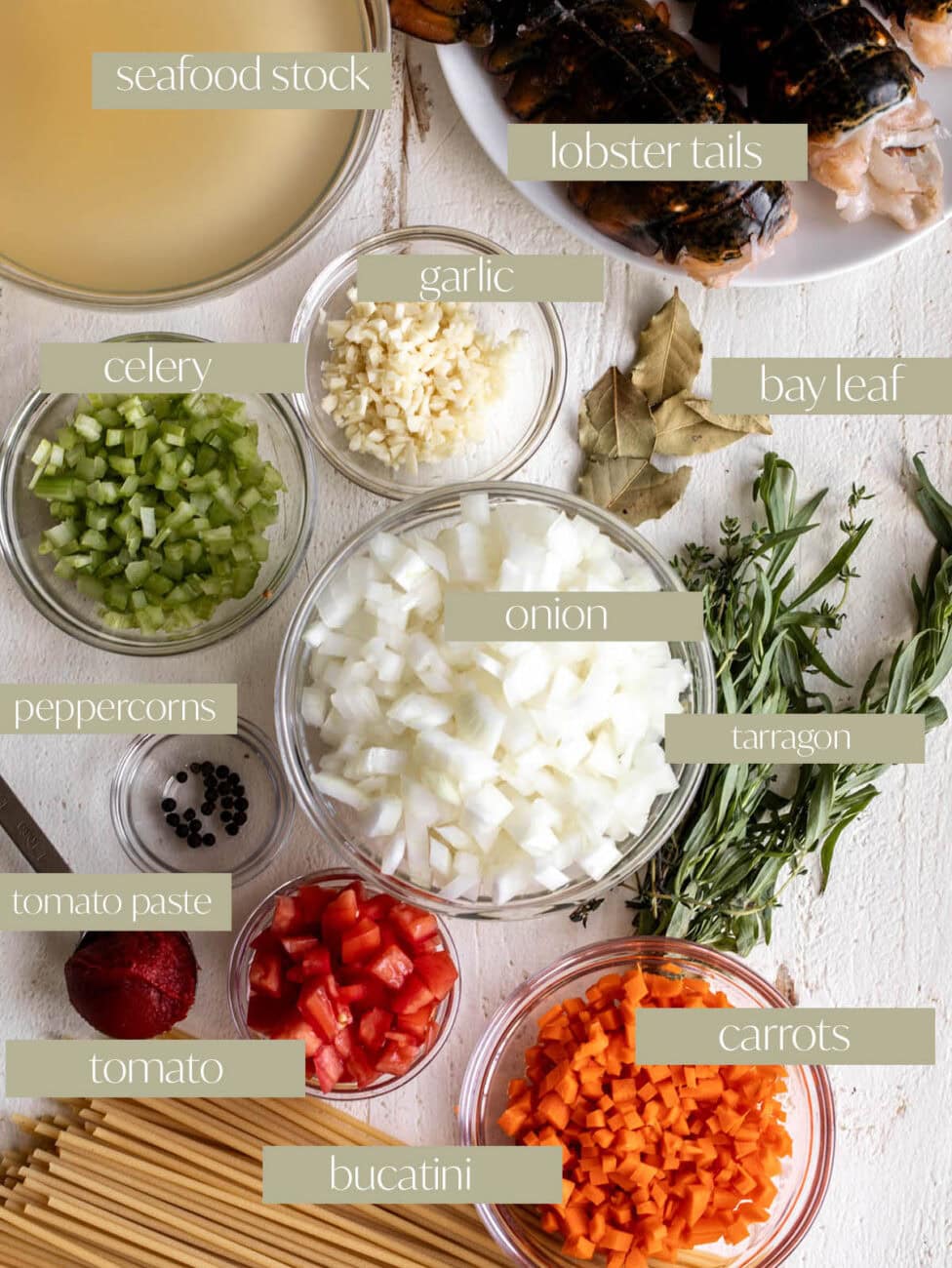 ingredients mise en place creamy lobster pasta herbs and chopped vegetables.