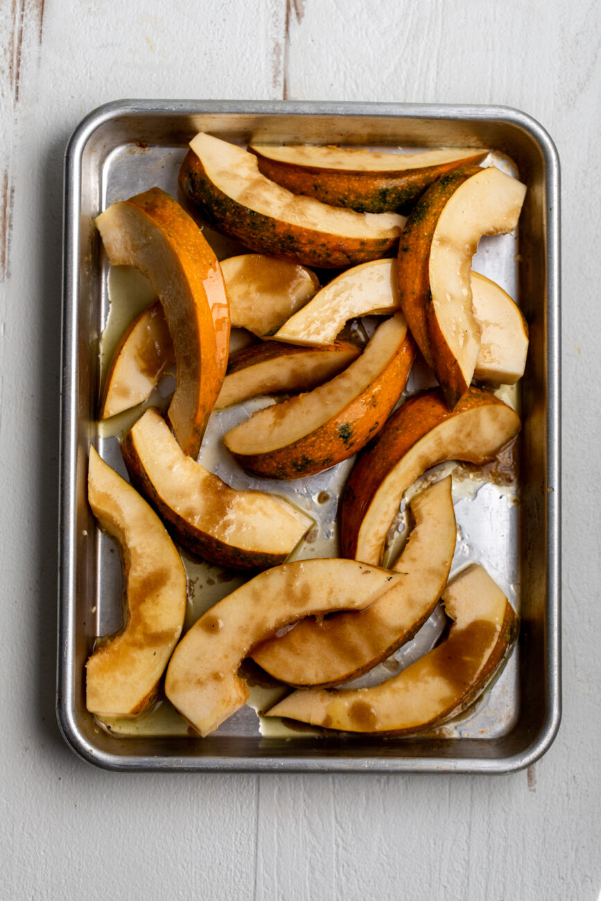 acorn squash ingredient shot on baking sheet.
