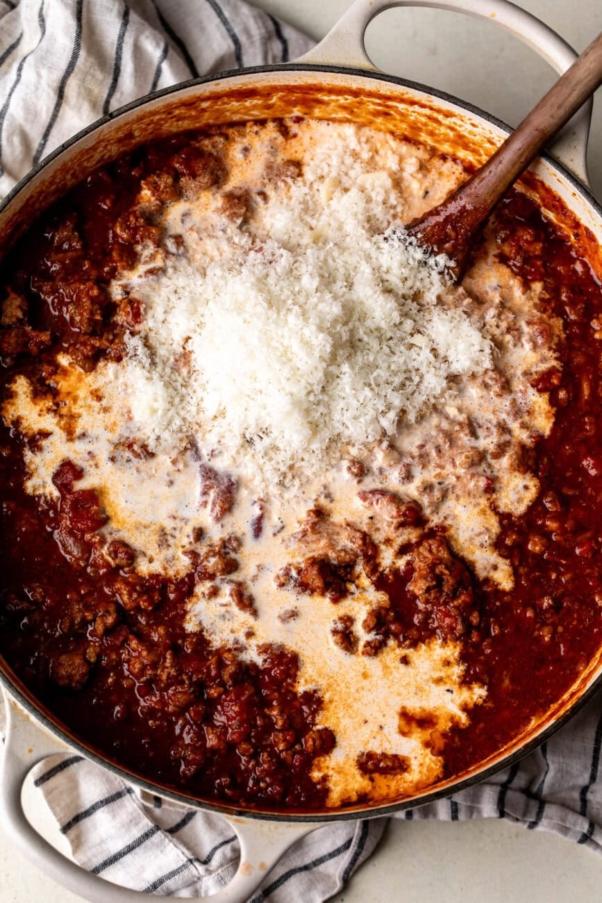 finishing slowly simmered 4-meat bolognese sauce with heavy cream and Parmesan cheese.