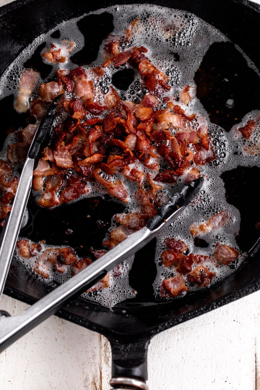 cooked bacon in pan.