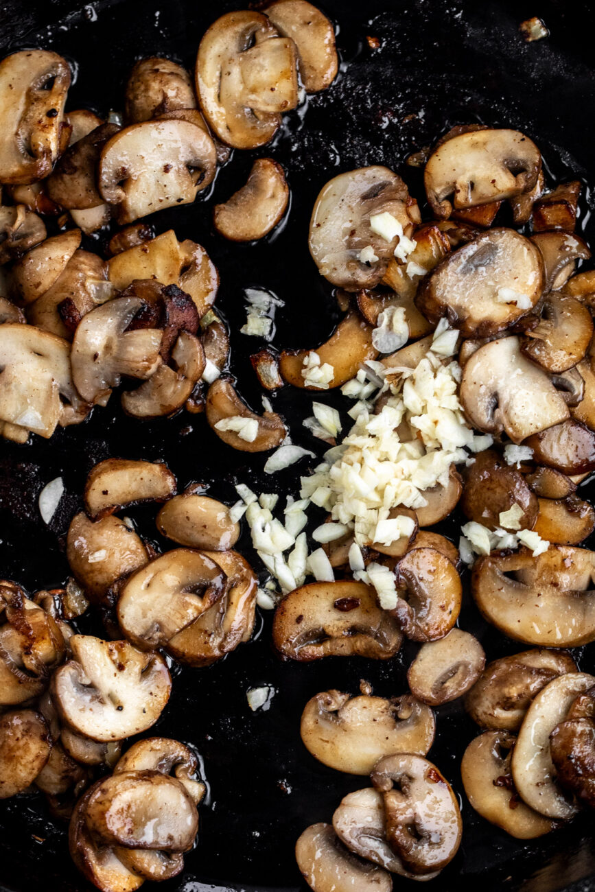 sautéed mushrooms and garlic in pan.