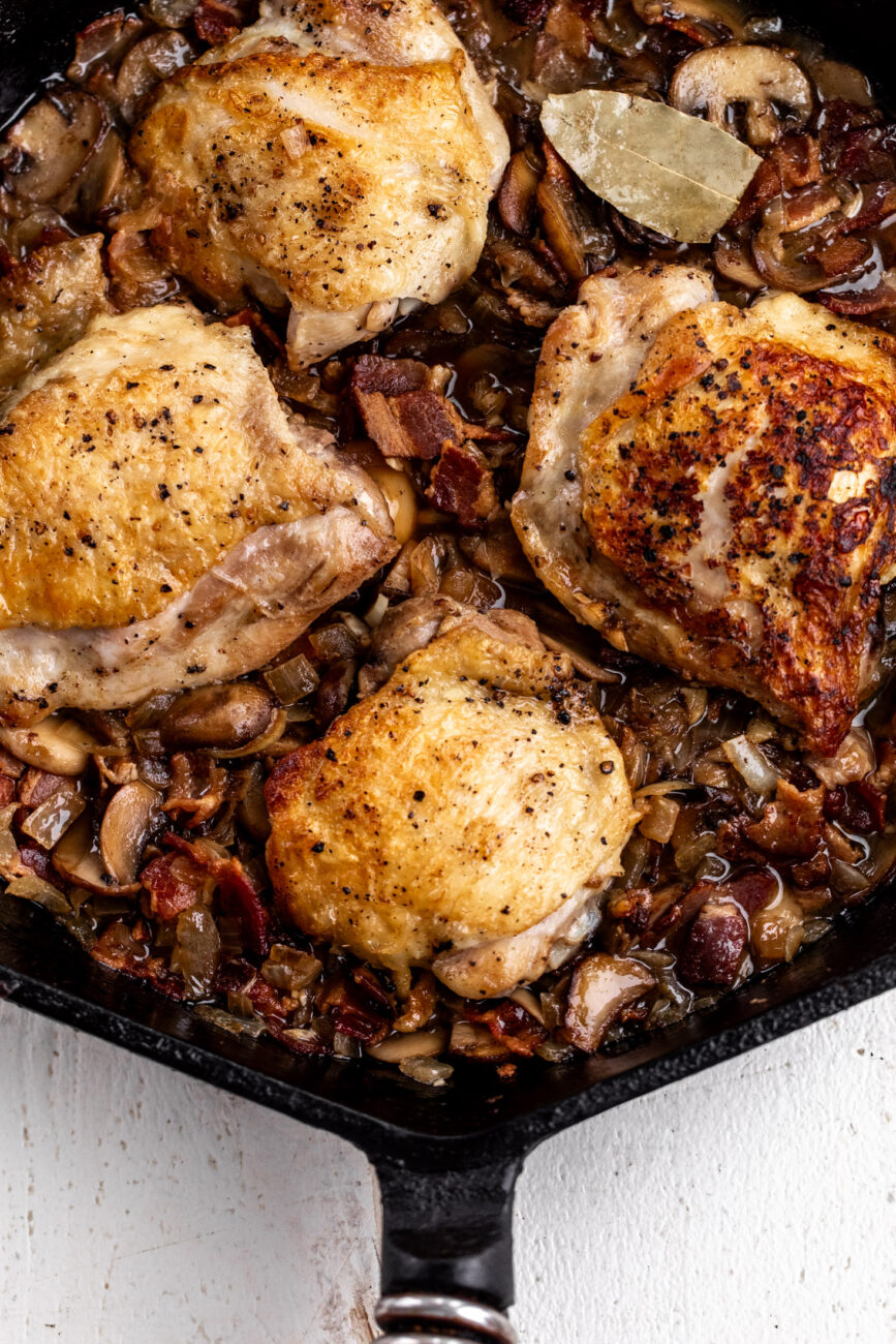 simmered chicken thighs with bacon, onions and mushrooms.