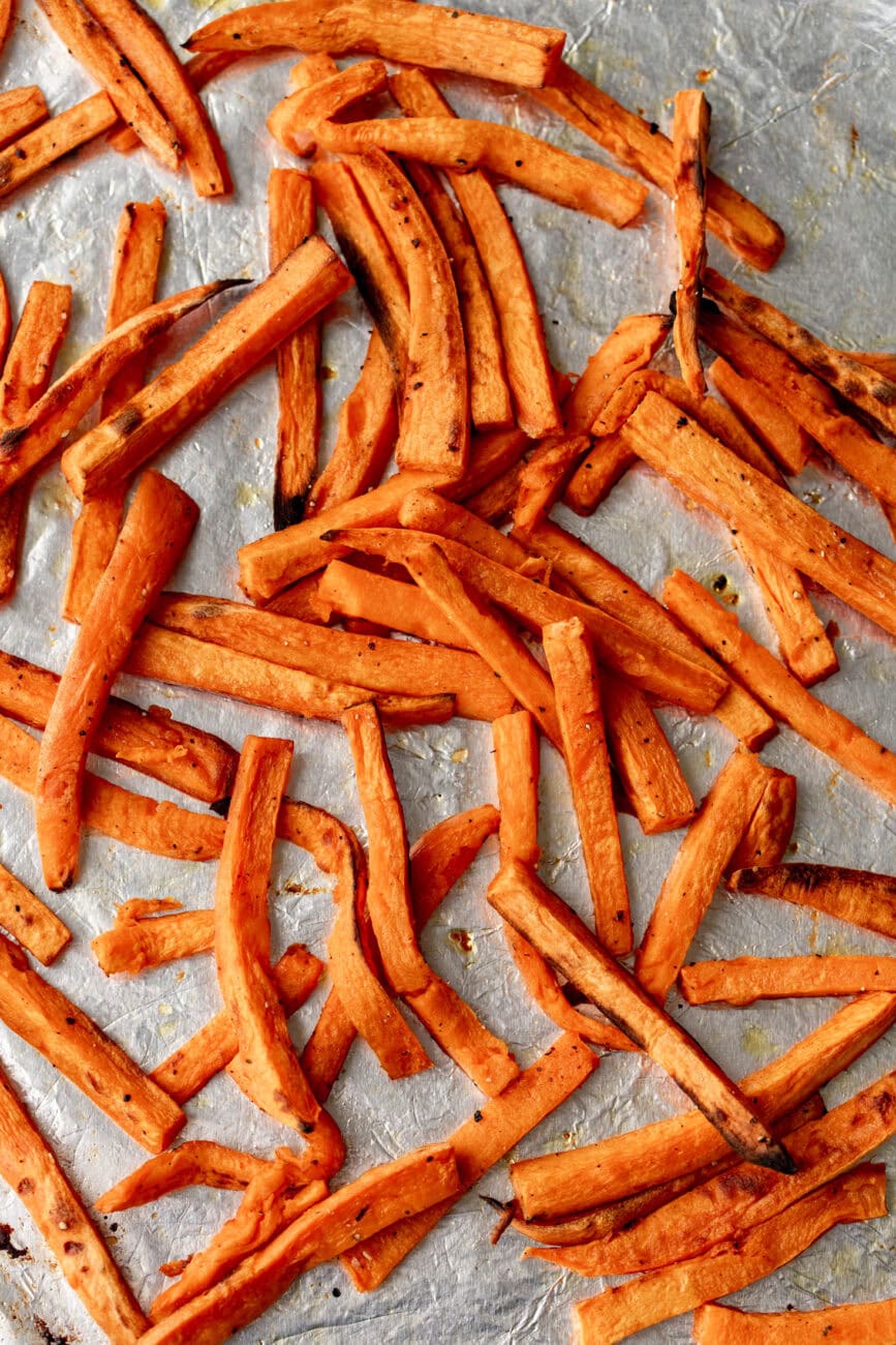baked sweet potato fries on baking sheet.