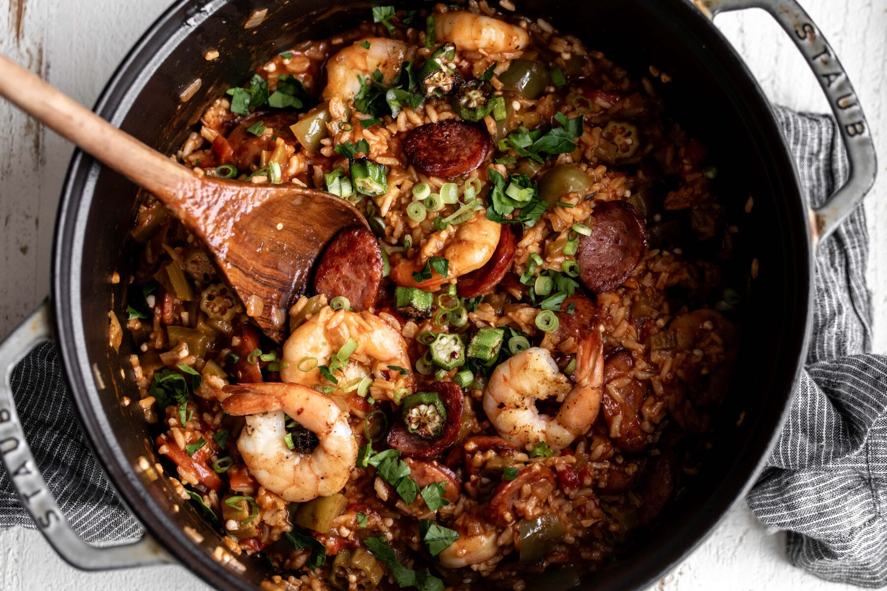 creole jambalaya in large pot with okra, shrimp and andouille sausage.