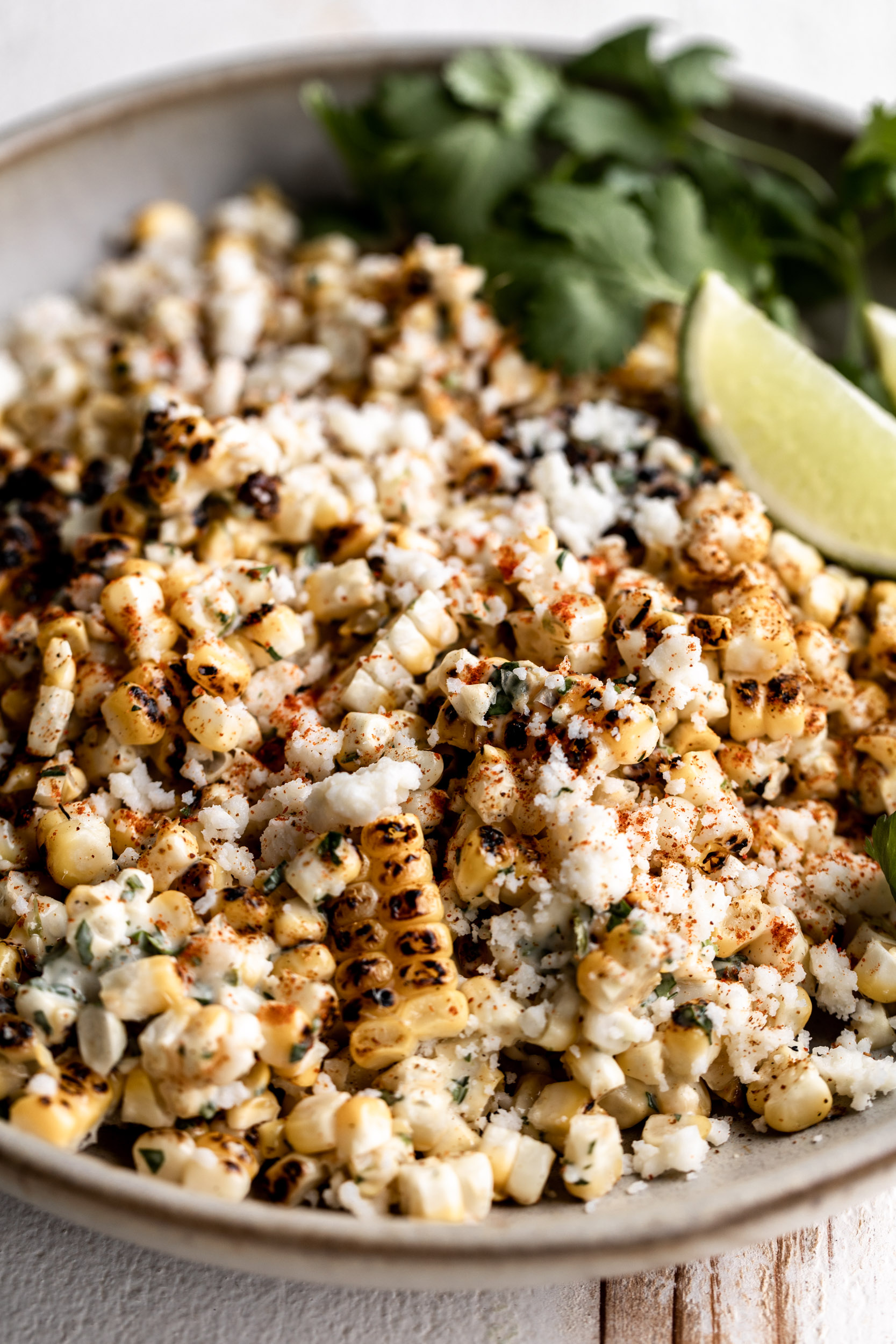 Mexican Elote Spicy Charred Corn with Cilantro Aioli & Cotija cut off the cob