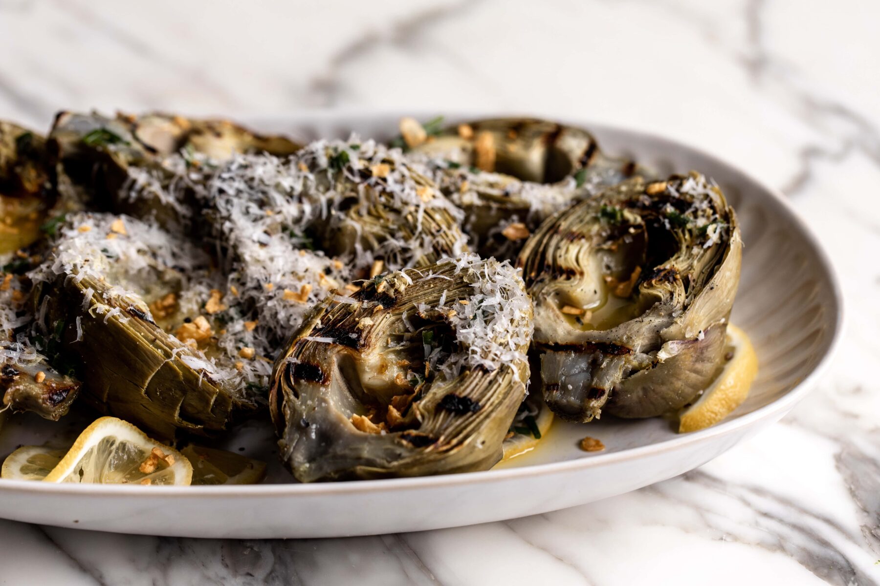 Grilled artichokes with lemon and pecorino.