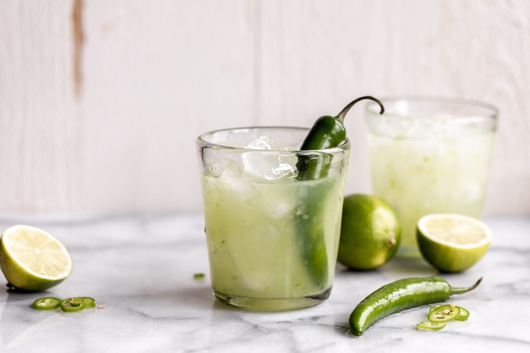 spicy cucumber margaritas with jalapeño and limes.
