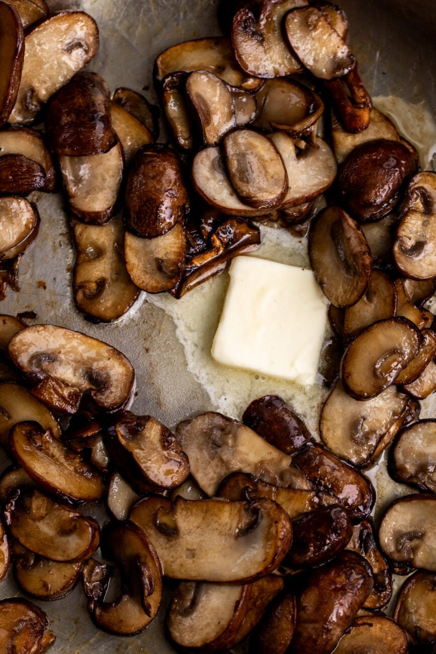 sautéed mushrooms in pan with butter.