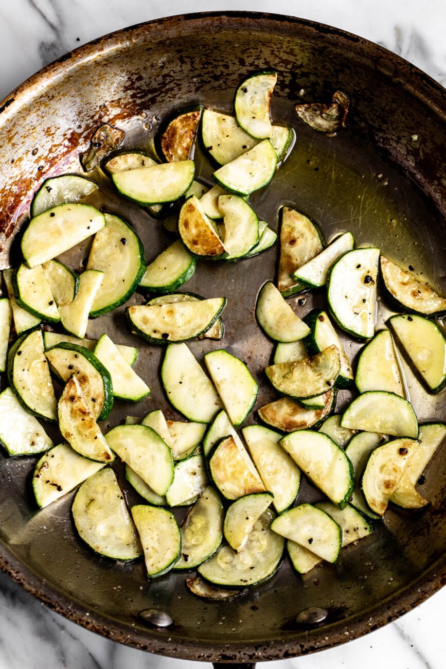 sautéed zucchini in pan.