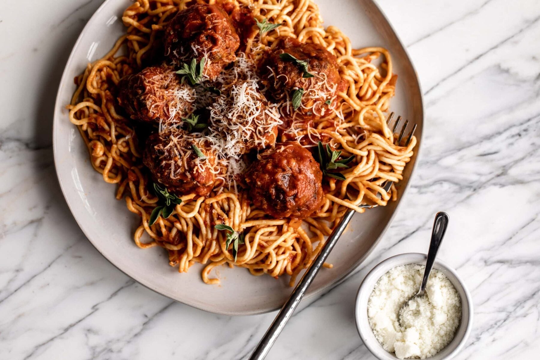 Beef, Pork & Prosciutto Italian Meatballs over spaghetti with marinara.