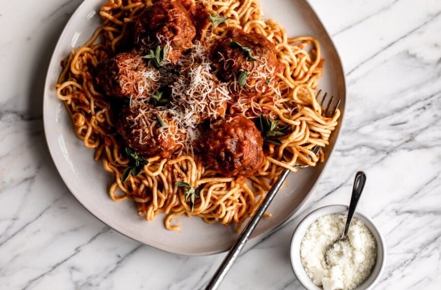 Beef, Pork & Prosciutto Italian Meatballs over spaghetti with marinara.