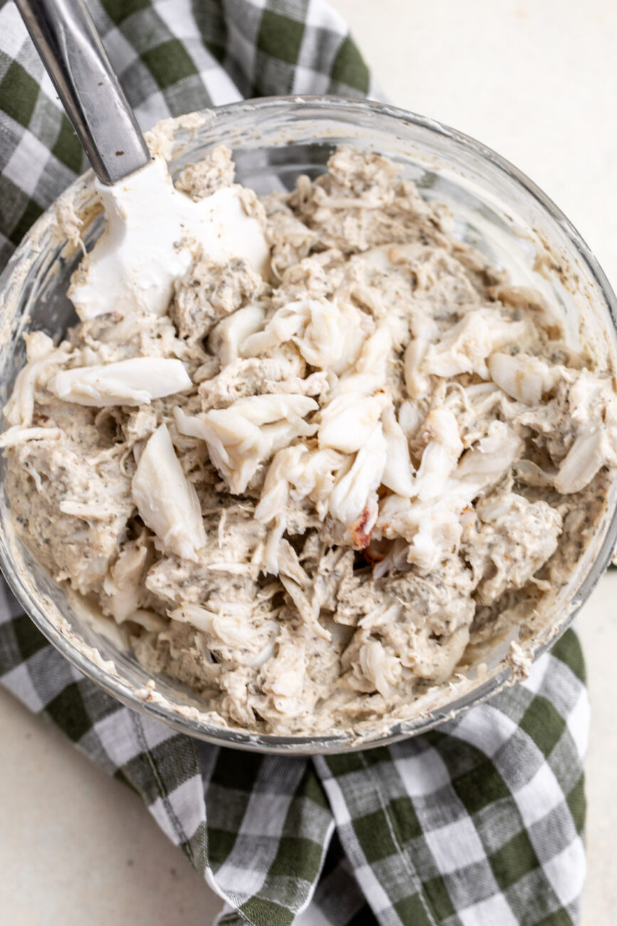 crab dip with large pieces of crab in mixing bowl.