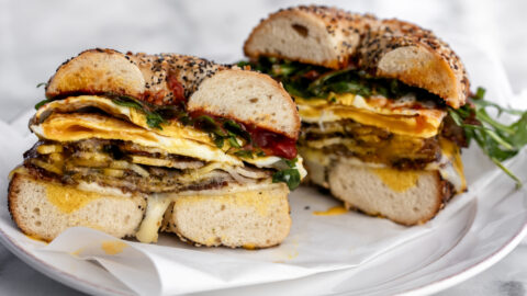 Porchetta egg and cheese breakfast sandwich on a bagel.