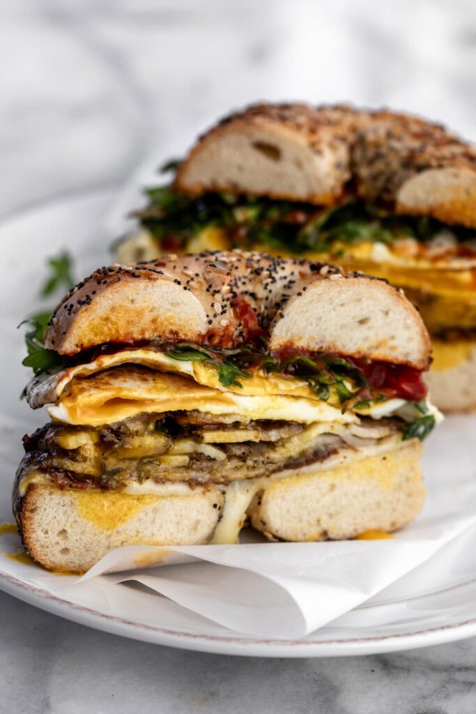 Porchetta egg and cheese breakfast sandwich on a bagel.
