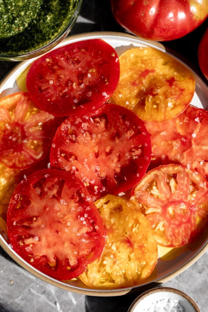 marinated sliced heirloom tomatoes with olive oil and sea salt.