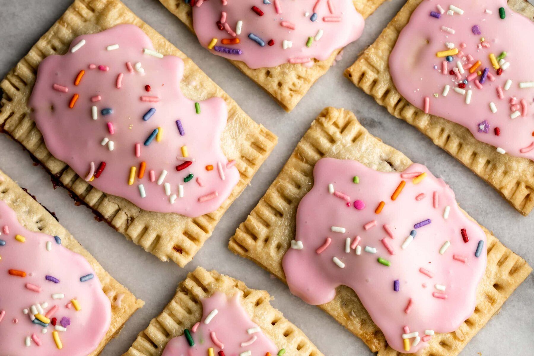 Homemade pop tart with jam and sprinkles.