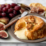 baked brie in crescent rolls with honey.