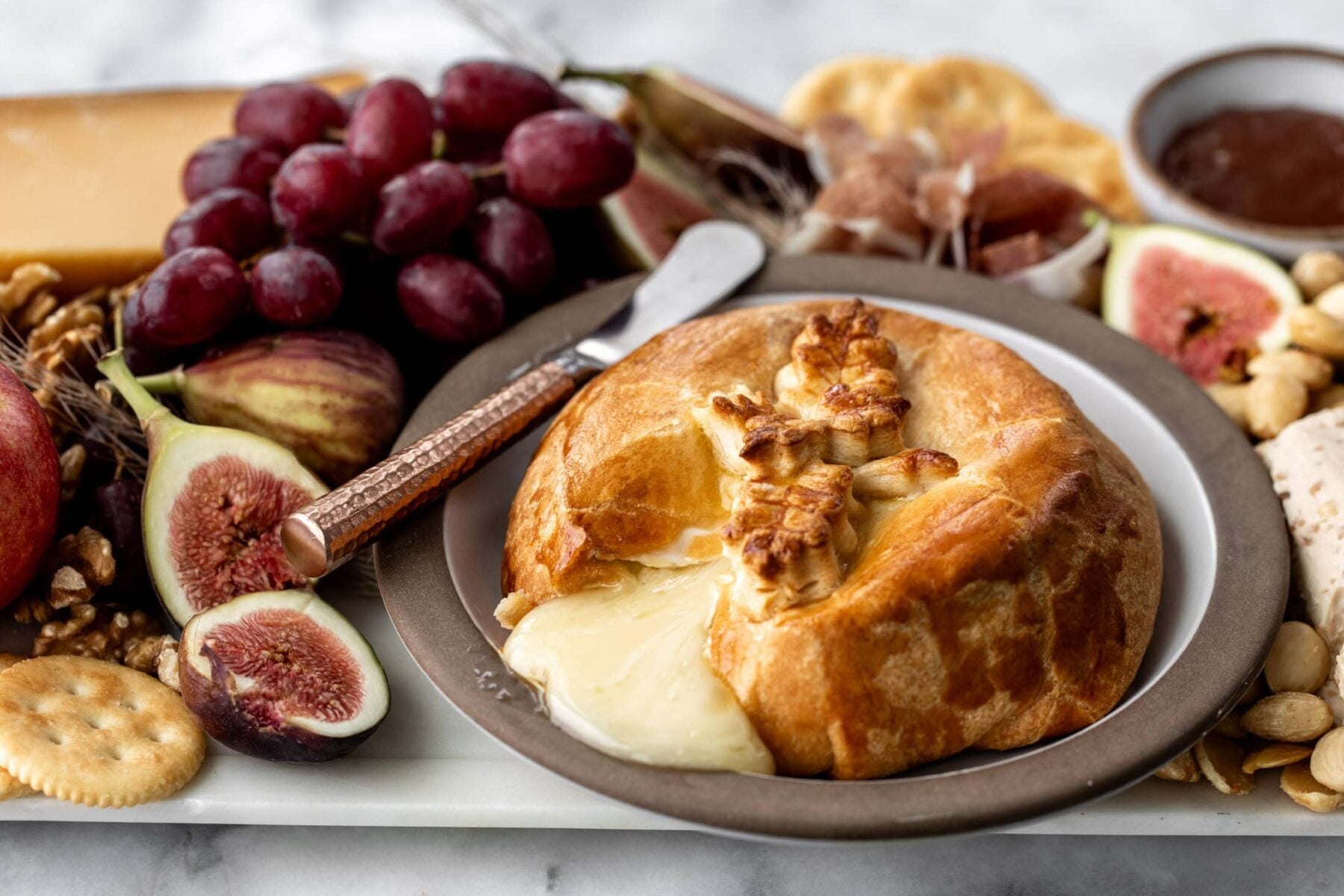 baked brie in crescent rolls with honey.