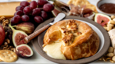 baked brie in crescent rolls with honey.
