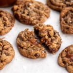chocolate caramel peanut butter pretzel dough with sea salt broken in half.