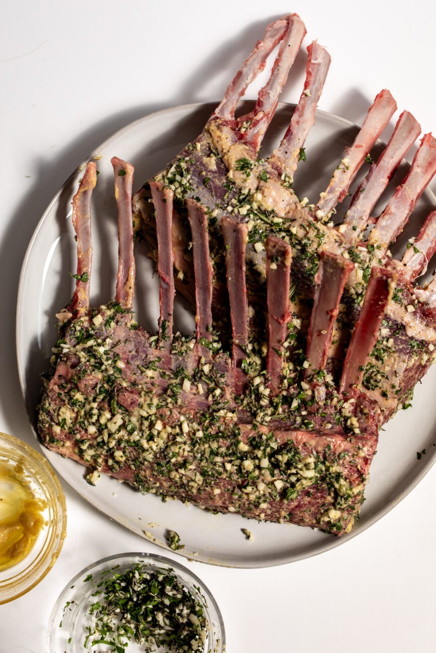 frenched rack of lamb with herb coating. 