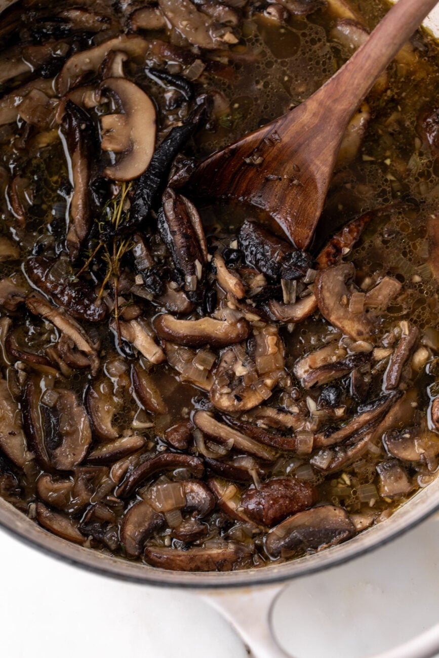 assorted mushrooms simmered in broth for creamy mushroom soup.