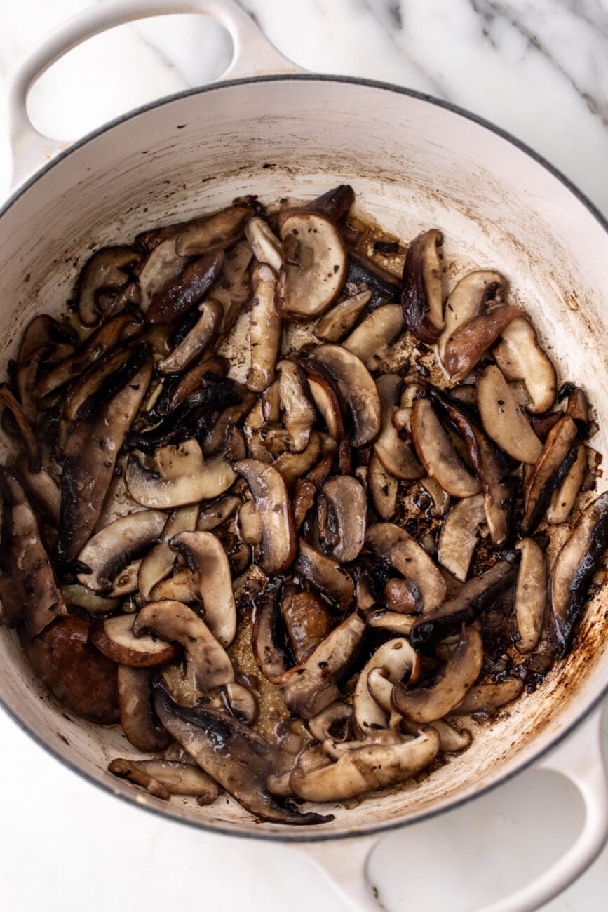 sautéed assorted mushrooms in pot.