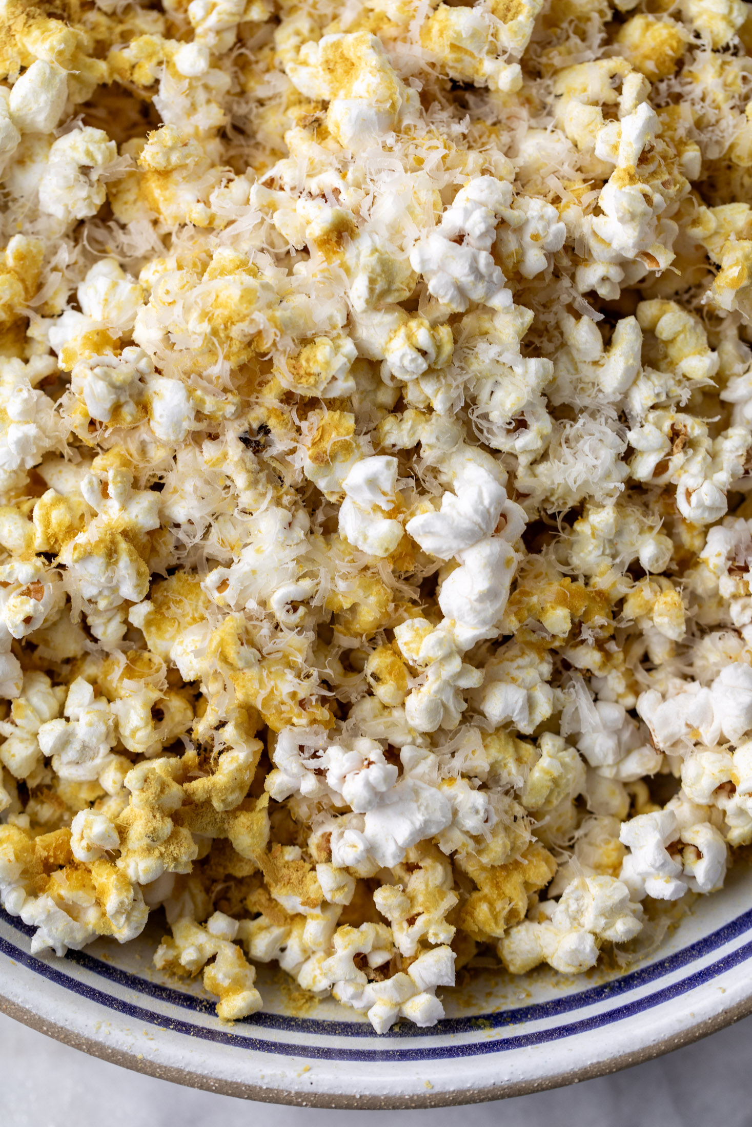 Garlic parmesan cheesy popcorn with nutritional yeast.