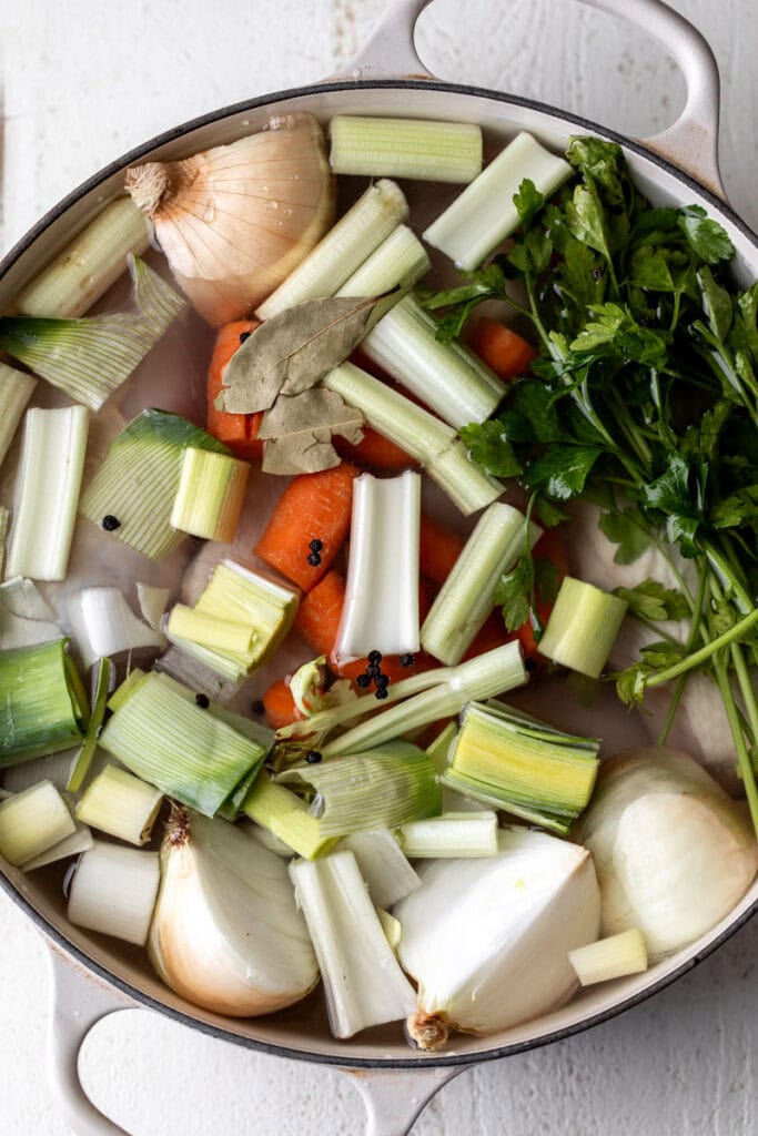 old school chicken noodle soup broth in pot.