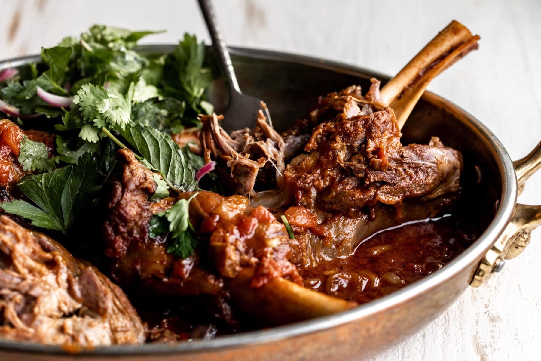 Braised Moroccan-Spiced Lamb Shanks with Herb Salad.