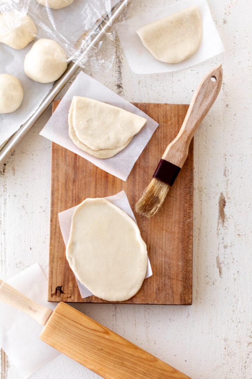 rolled out bao bun dough into ovals.