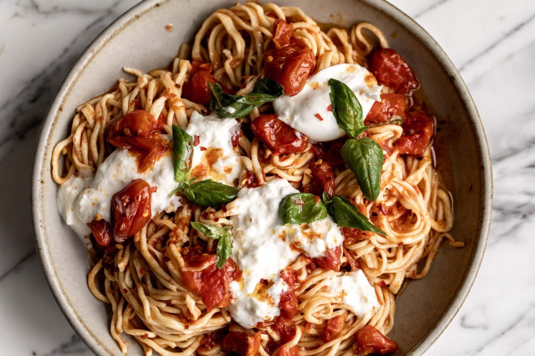 Homemade Spaghetti with Confit Cherry Tomatoes, Burrata & Basil.
