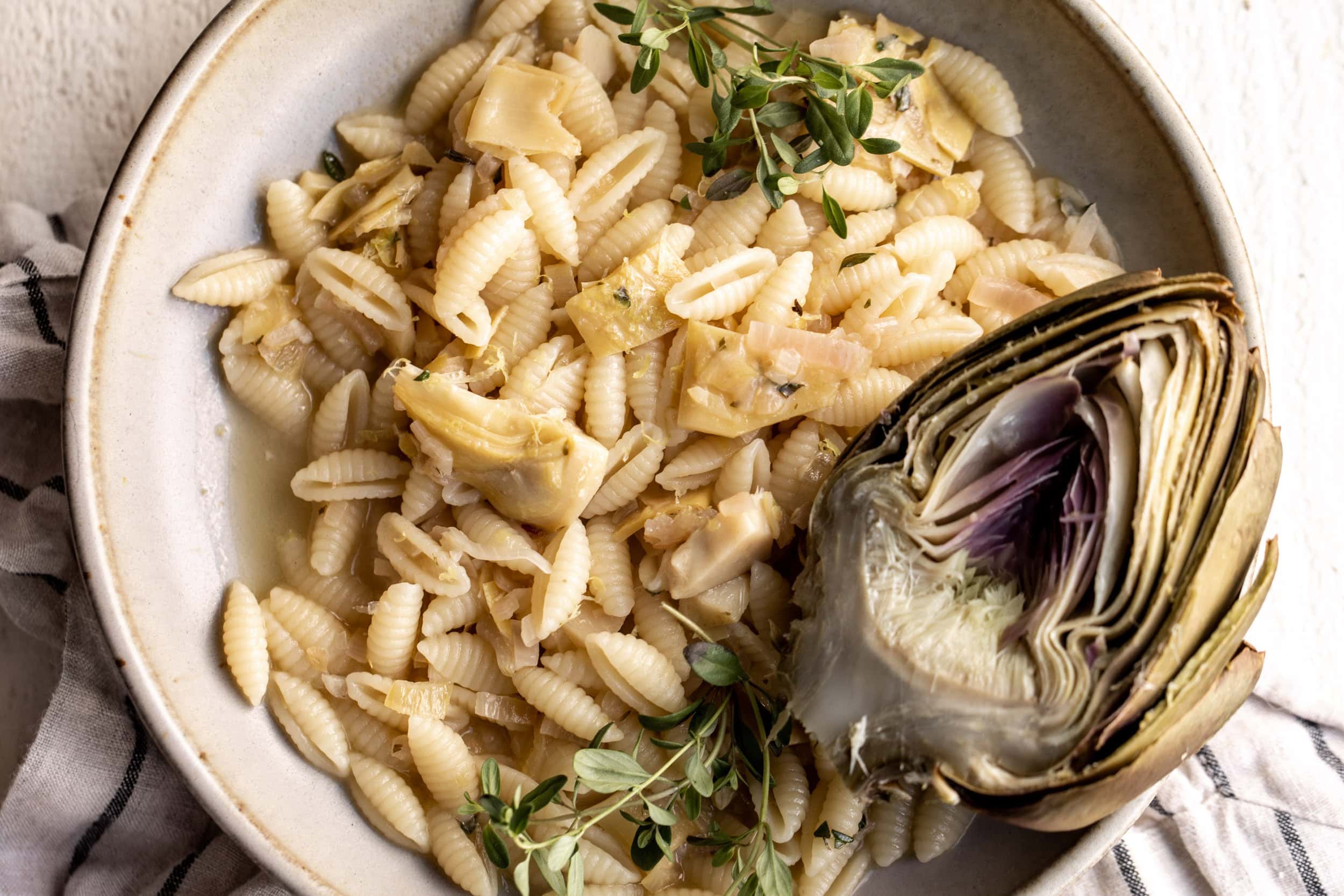 Lemon Artichoke Pasta Cooking with Cocktail Rings