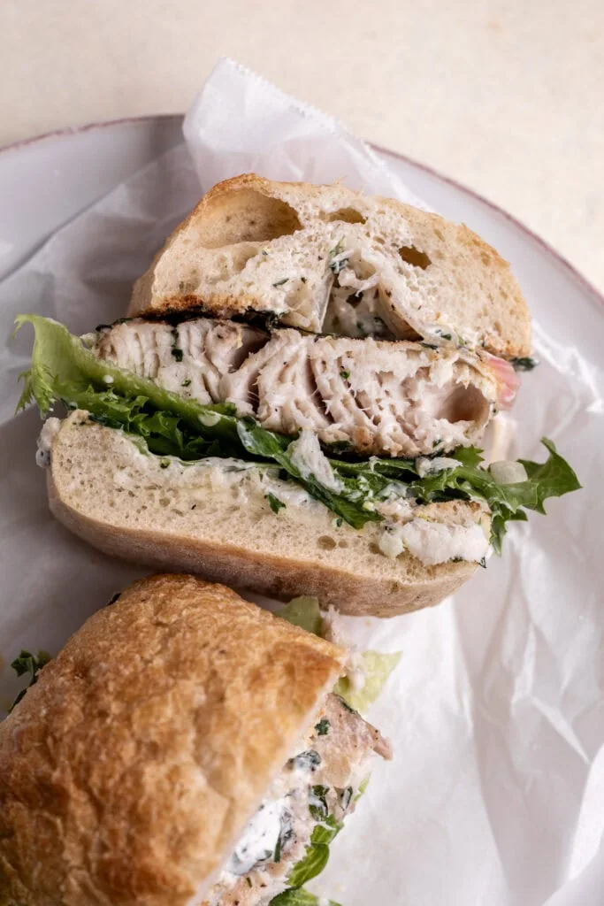 mahi mahi seared fish sandwich cut in half