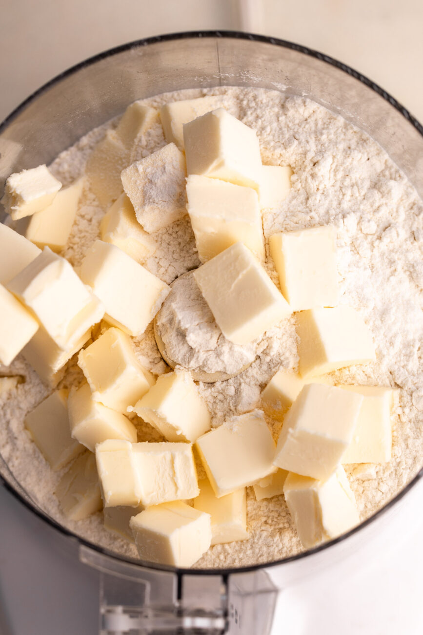 dough with butter for pie crust in food processor.