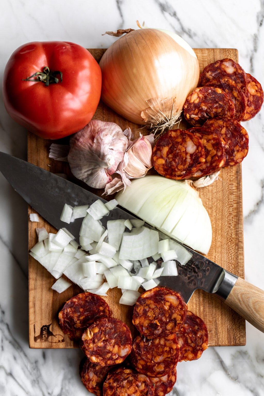 Seafood and Chorizo Paella Cooking with Cocktail Rings