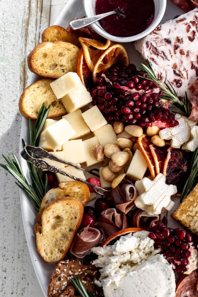 cheddar cheese cubes on cheeseboard.