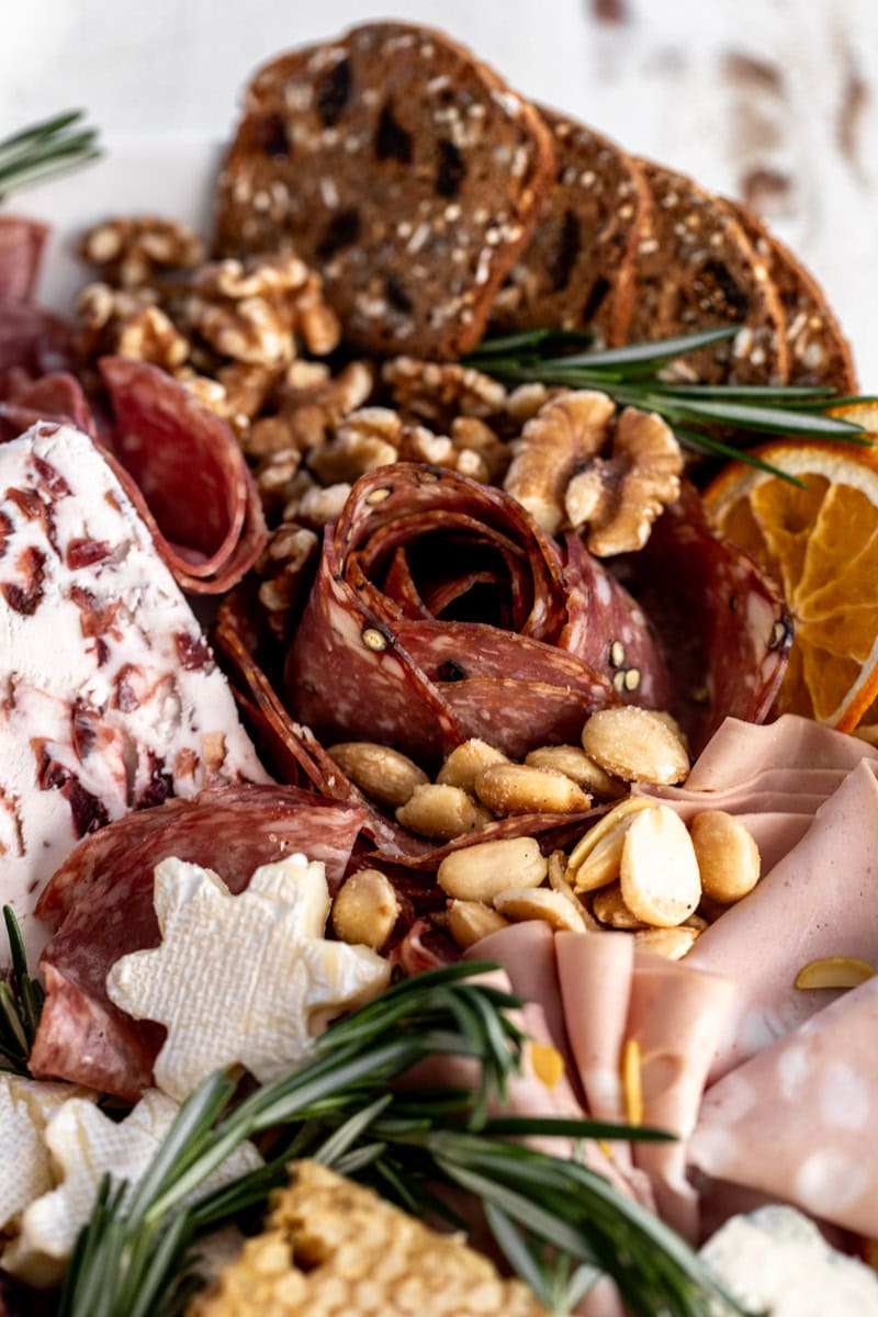 salami rose on cheeseboard.