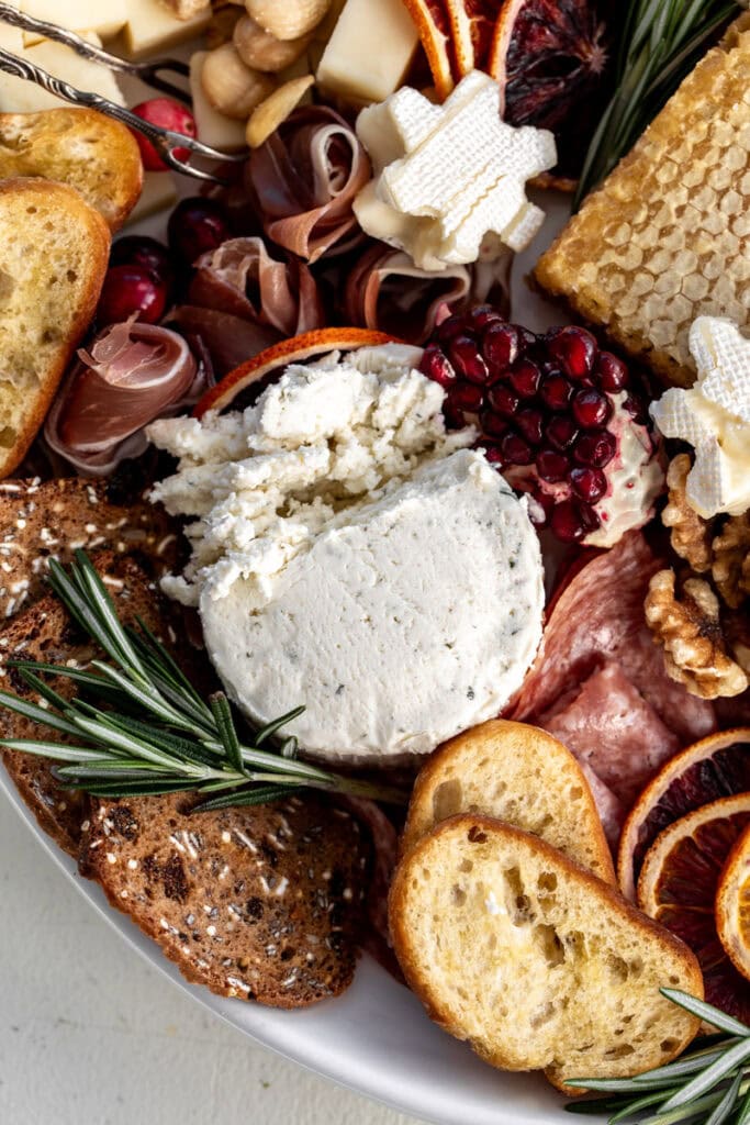 boursin cheese in a festive holiday cheese board.