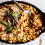 If you like other corn side dishes like Mexican eloté, you will like this Korean corn cheese! The corn is cut off the cob then sautéed in a pan and tossed with a mayonnaise and gochujang mixture for a creamy and spicy sauce, green onions, cheese and of course the pièce de résistance – salty bacon. Most versions of this Korean-American recipe simply use mayonnaise, however, I like the added spice and flavor of gochujang.