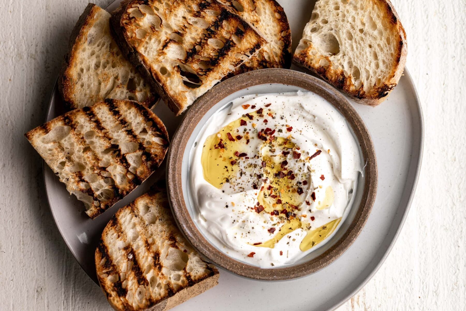 whipped spiced ricotta dip with grilled bread.