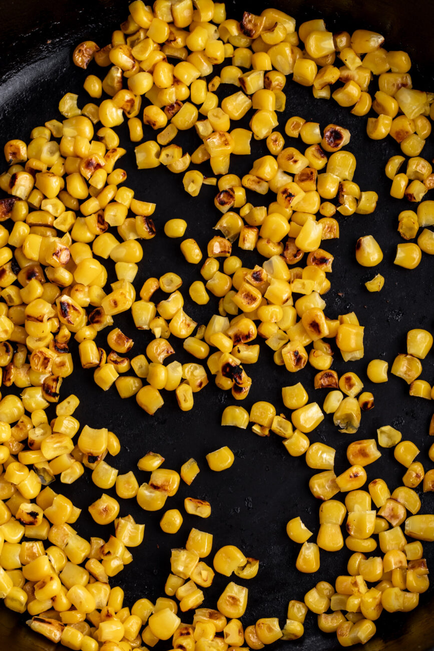 dry charred corn in skillet.