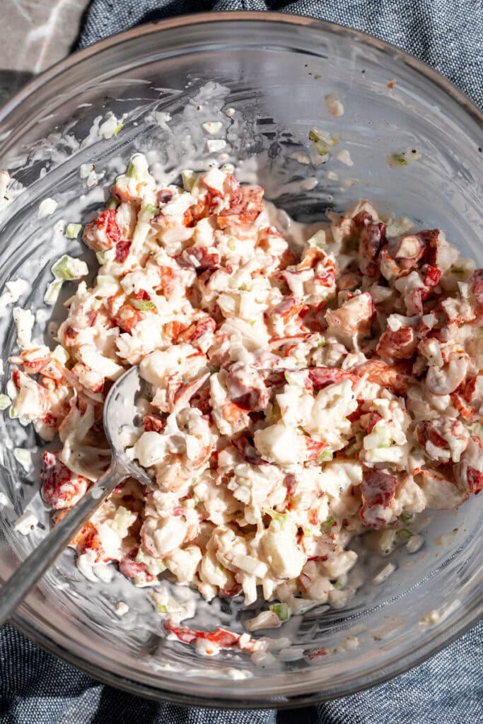 lobster salad mixed in glass bowl.