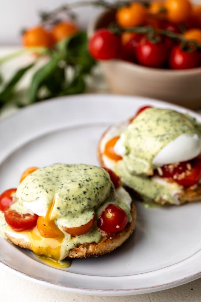toasted English muffins with fresh mozzarella, marinated cherry tomatoes, poached eggs, and basil-infused hollandaise sauce.