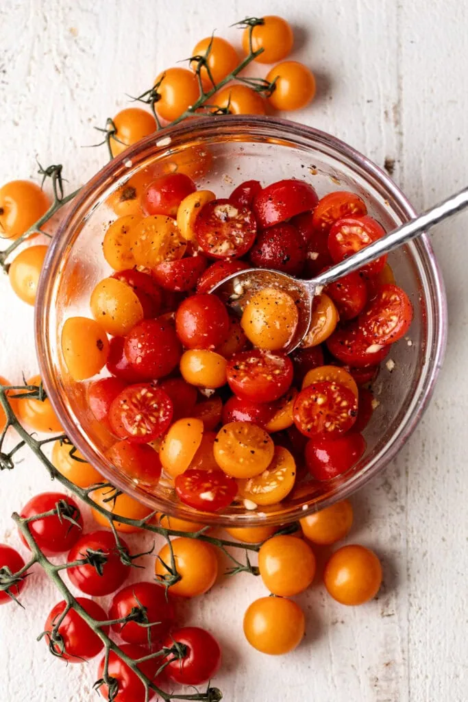 marinated cherry tomatoes on the vine for caprese eggs benedict